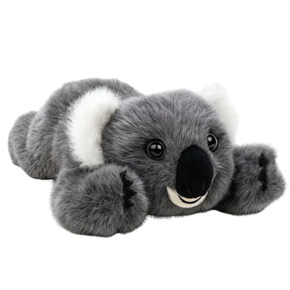 Koala de peluche tumbado